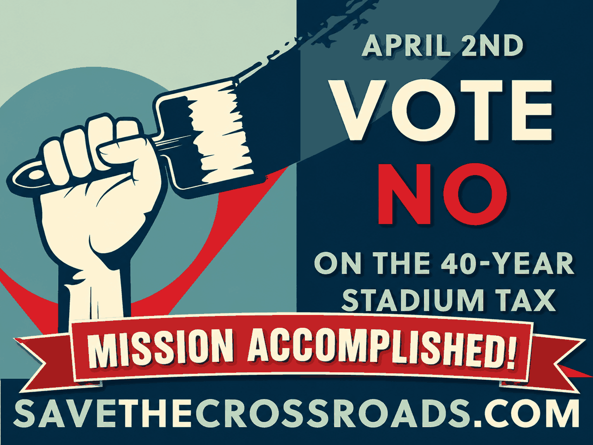 Campaign sign: a fist gripping a paintbrush beside the words "April 2nd — Vote NO on the 40-year stadium tax," with a red banner reading "Mission Accomplished!" and the address savethecrossroads.com.